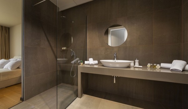 Modern bathroom of Croatia luxury family villa Elena with shower cabin and sink with mirror for vacation