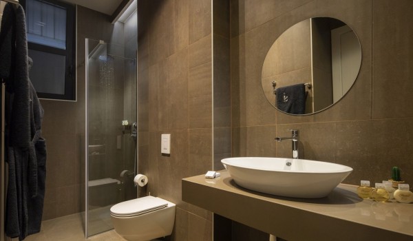 Bathroom of Croatia luxury pool villa with shower cabin and sink with mirror for vacation and rent