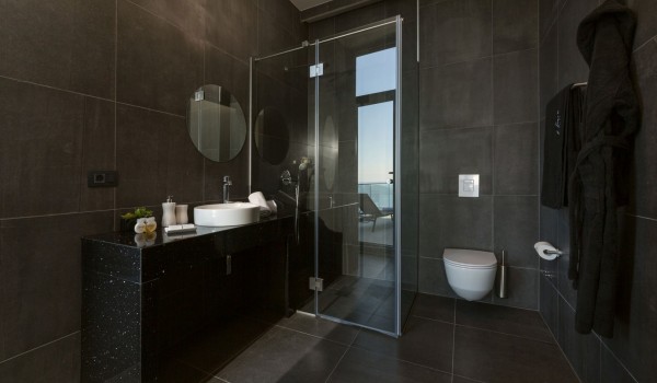 Bathroom of Croatia luxury rental villa with shower cabin and sink with mirror for family vacation