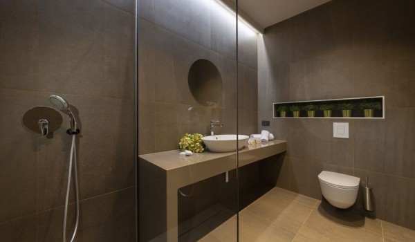 Bathroom of Croatia luxury pool villa with shower cabin and sink with mirror for vacation and rent