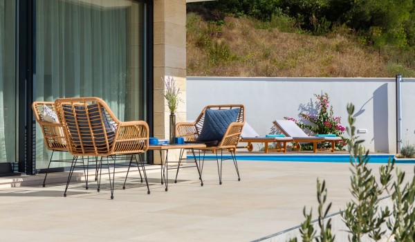 Outdoor furniture at terrace of Makarska villa Azul for family vacation with private pool and sea view.