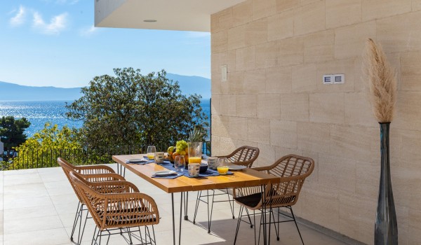 Outdoor dining area near pool of holiday luxury villa Azul in Makarska for vacation and rent.