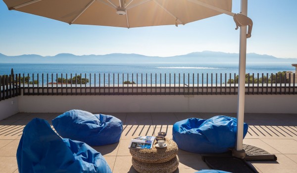 Sunny terrace with outdoor furniture and parasol in Makarska Luxury Villa with private pool and sea view.