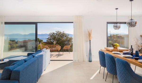 Dining room and cozy living room with balcony in Makarska luxury pet-friendly villa with pool for vacation and rent.