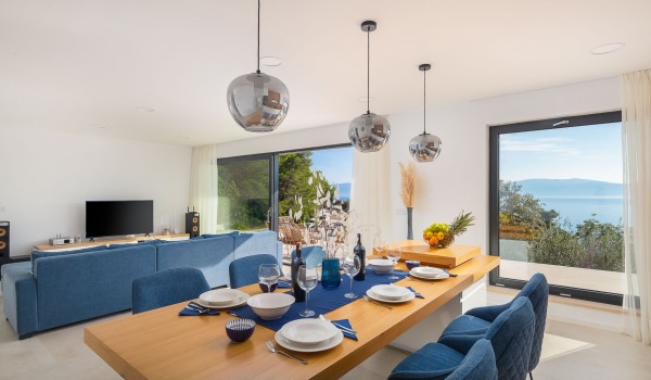 Dining room and cozy living room with balcony in Makarska luxury pet-friendly villa with pool for vacation and rent.