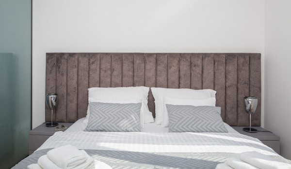 Spacious bedroom with King-size bed and en suite bathroom in luxury villla Makarska for vacation and rent.