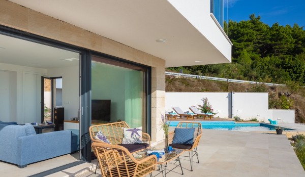 Terrace with outdoor furniture near pooll in Makarska  luxury pet-friendly villa for vacation and rent.