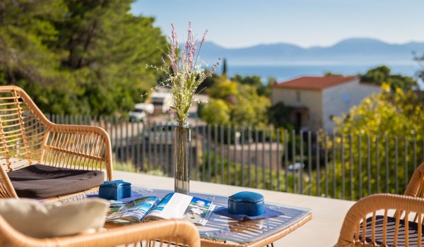 Sunny terrace with outdoor furniture near pooll in Makarska  luxury pet-friendly villa for vacation and rent.