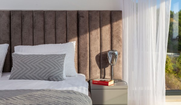 Spacious bedroom with King-size bed and sea view in luxury pet-friendly villla Azul in Makarska for vacation and rent.