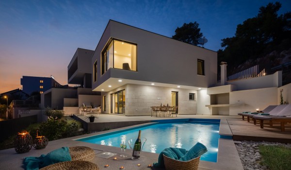 Outdoor pool with outdoor furniture in Makarska luxury beachfront villa for vacation and rent.