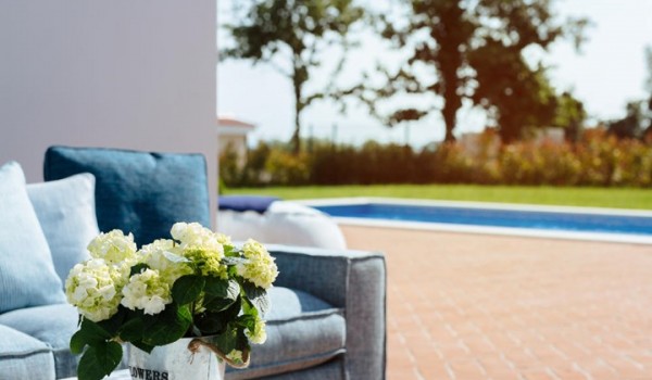 A view of the small table and outdoor terrace of the luxury rental villa Lea in Vabriga in Istria