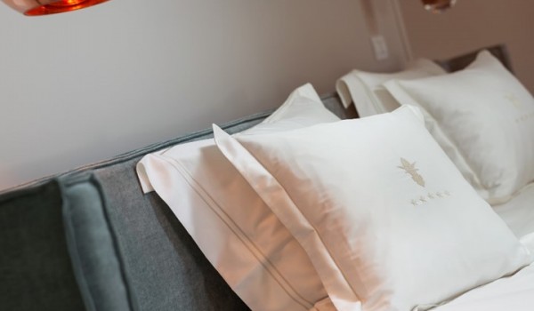 A view of the double bed and night lamp in the bedroom in the luxury holiday villa Lea in Vabriga in Istria