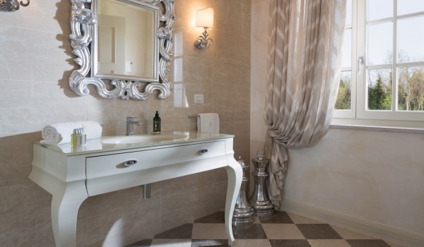 Wooden dressing table and mirror in the bathroom in the luxury villa Lea in Vabriga in Istria