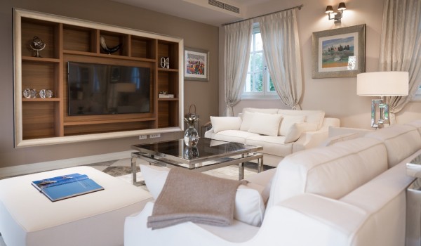 White sofas, stools and coffee table and LCD TV in the living room in the luxury villa Lea in Vabriga in Istria