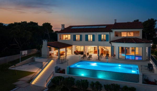 Night view of the luxury seafront villa Sea Whisper for vacation with friends near Šibenik
