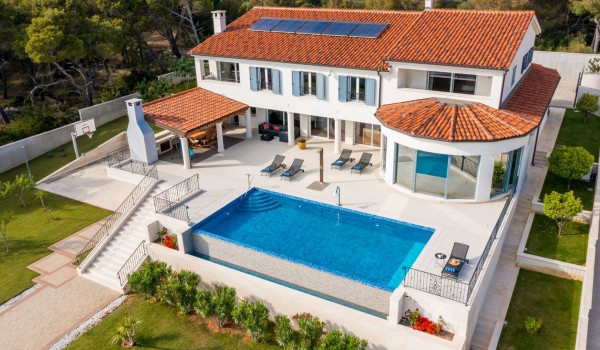 View of the Croatian luxury family villa Sea Whisper with outdoor and indoor pool in Sibenik