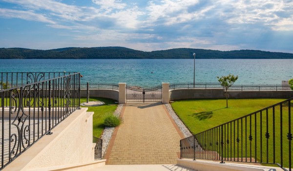 Paved road to the Croatia luxury family villa for vacation by the sea in Sibenik