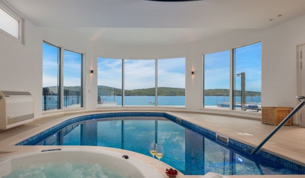 Indoor heated pool and jacuzzi of the luxury beachfront villa for family vacation in Sibenik