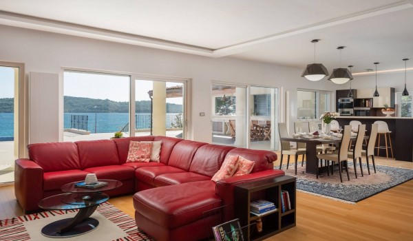 Large comfortable sofa and dining table in the Luxury holiday villa with concierge service