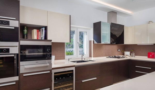 Fully equipped kitchen with wine cooler in the luxury beachfront villa for family vacation in Sibenik