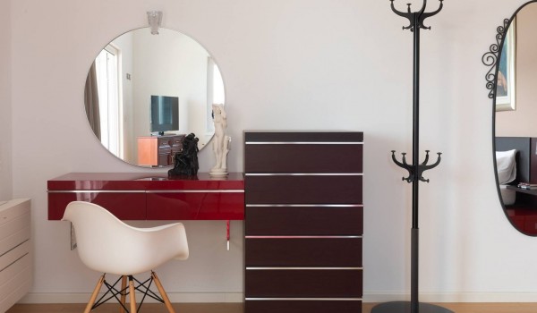 Seating area in front of a mirror in the Luxury vacation villa with outdoor and indoor heated pool