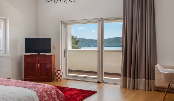 Bedroom with private terrace of the Sibenik luxury holiday villa with concierge service ans sauna