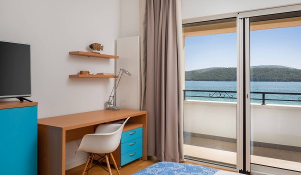 Working station in a bedroom with private terrace of the luxury beachfront villa for family vacation in Sibenik