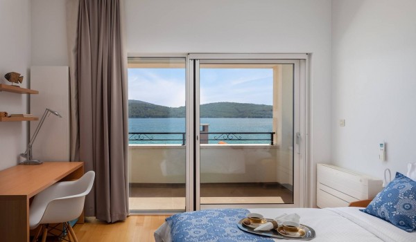 Working station in a bedroom with private terrace of the luxury beachfront villa for family vacation in Sibenik