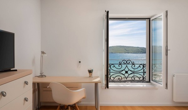 Seating area in a bedroom with sea view of the Luxury Sibenik villa for family vacation by the sea