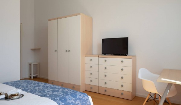 Closet and TV in a bedroom of a luxury holiday villa with concierge service and sauna in Sibenik