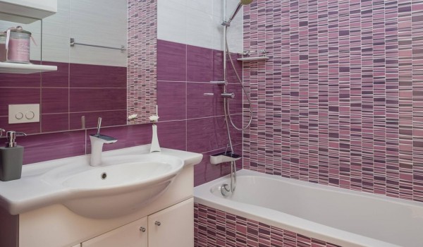 Pink bathroom with bathtub in a luxury vacation villa Sea Whisper Sibenik with heated pool and sauna