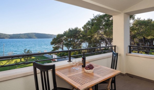 Seating area on a terrace with sea view in the luxury family villa with gym and sauna in Sibenik