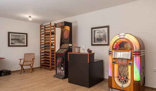 Darts, jukebox and wine rack in a luxury holiday villa Sea Whisper by the sea in Sibenik