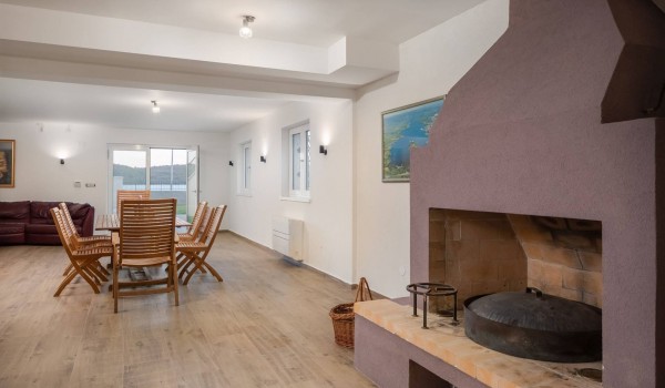 Dining table and indoor grill in the luxury villa Sea whisper for vacation with family and friends with concierge service