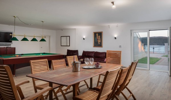 Dining table on the ground floor of the luxury vacation villa at the beach in Sibenik