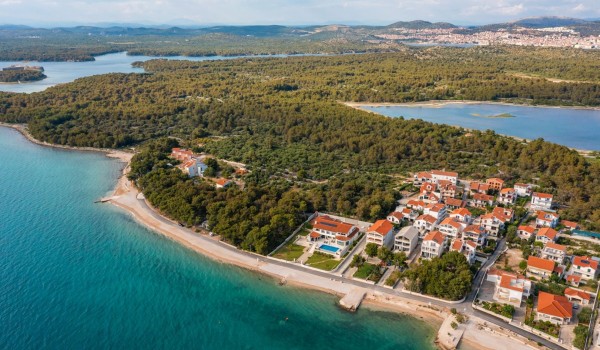 Aerial view of a luxury villa Sea Whisper with private pool, sauna, jacuzzi and gym by the sea in Sibenik