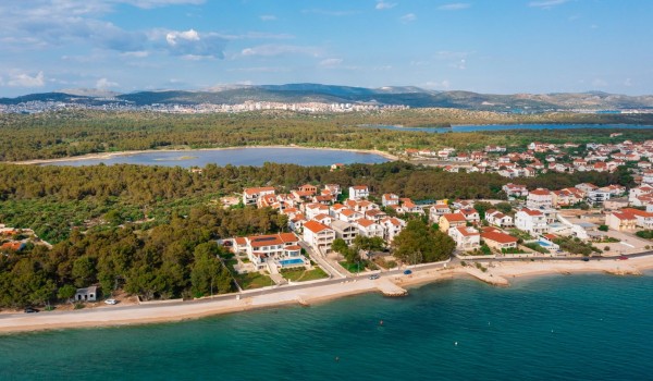 Aerial view of a luxury villa Sea Whisper with private pool, sauna, jacuzzi and gym by the sea in Sibenik