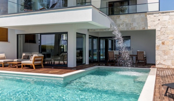 Seating area by the pool on the terrace of the Croatia luxury vacation rental villa in Kastela