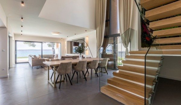 Dining table and staircase of the Croatia luxury rental villa with private infinity pool in Split