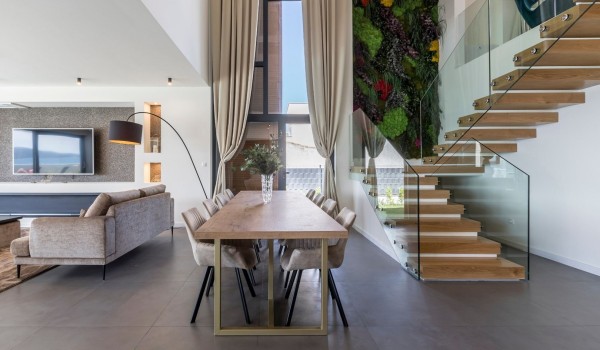 Dining table and staircase of the Croatian luxury villa with private infinity pool and concierge service in Split