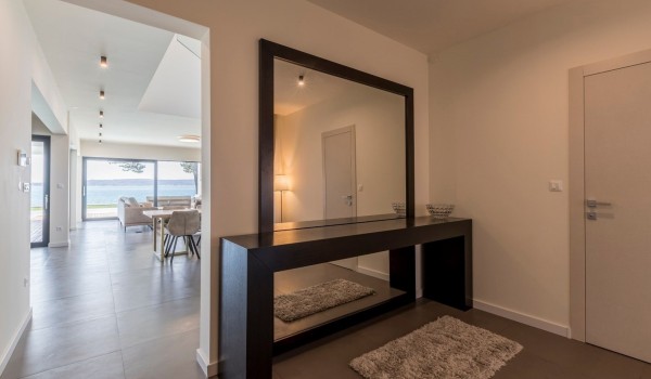 Large mirror in the hallway of Croatia family villa in Split with private pool and concierge service