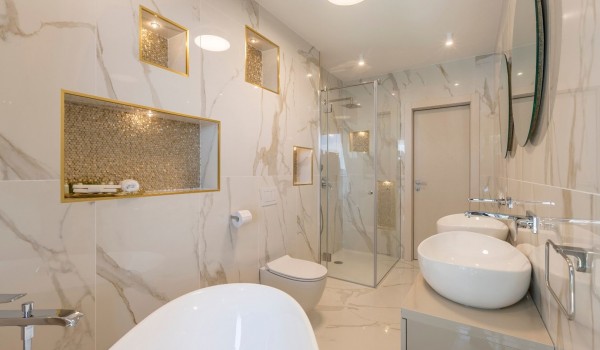 En suite bathroom with marble décor of the luxury beachfront villa Papillon with private pool with total privacy