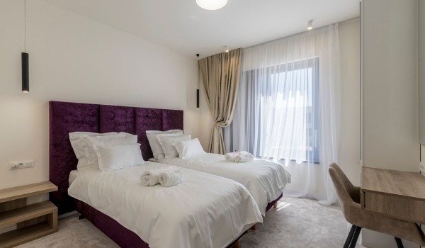 Twin beds in bedroom of the luxury vacation villa by the sea in Kastela with total privacy