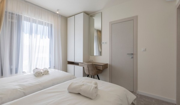 Twin beds in bedroom of the luxury vacation villa by the sea in Kastela with concierge service