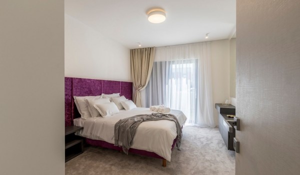 Luxury bedroom with king size bed in the beachfront family villa with private pool in Kastela