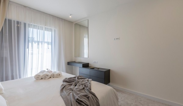 Luxury bedroom with king size bed in the beachfront family villa with private pool in Kastela