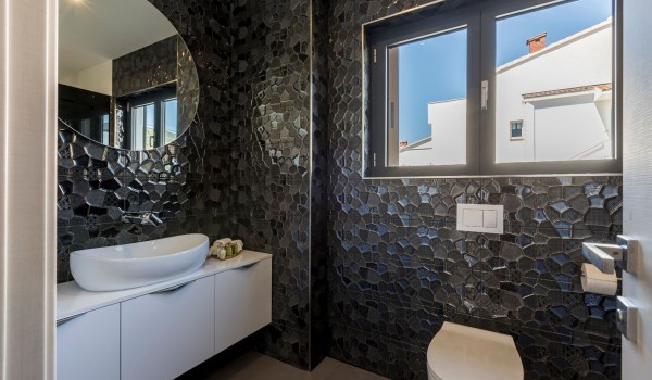 Bathroom with sink and toilet in the luxury villa for family vacation by the sea with total privacy