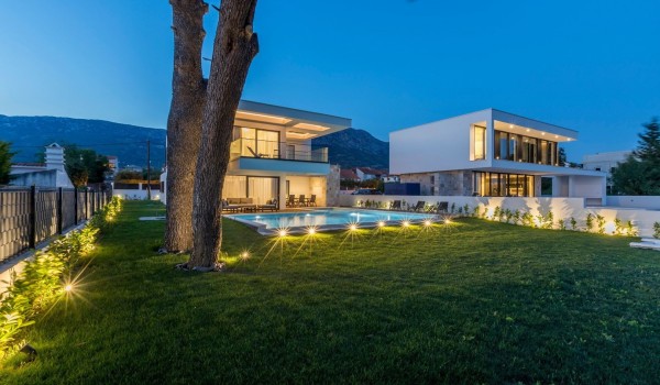 Landscaped garden and pool of the luxury family villa with private parking and Wi-Fi with total privacy