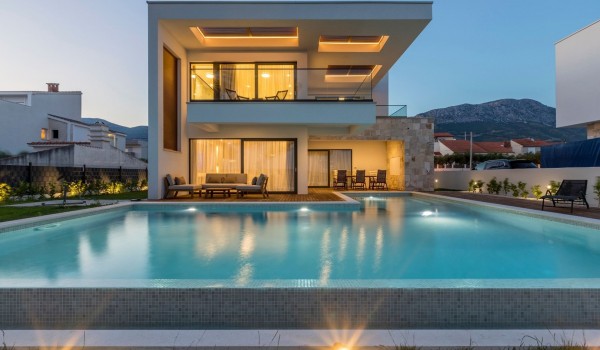 Night view of the luxury vacation villa Papillon with private pool and parking with total privacy