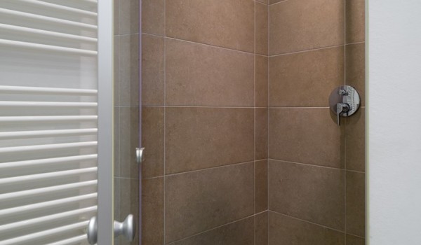 Walk-in shower in en suite bathroom in bedroom of a luxury family villa with private swimming pool and parking